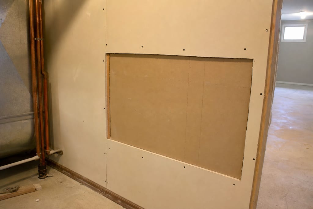 Removing damaged drywall photo